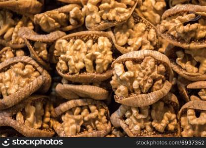 Pile of whole fresh walnuts without nutshells in fig