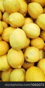 Pile of yellow lemons on a market
