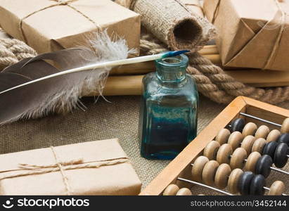 pile parcel wrapped with brown kraft paper and abacus