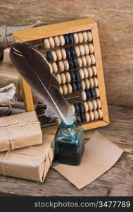 pile parcel wrapped with brown kraft paper and abacus