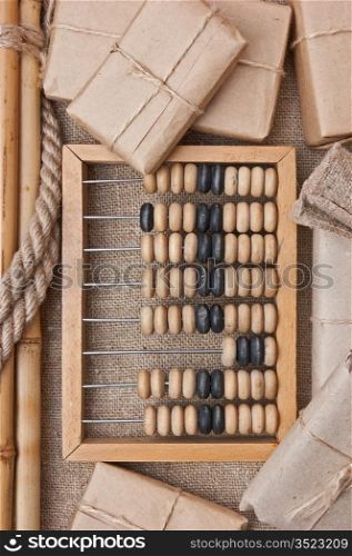 pile parcel wrapped with brown kraft paper and abacus