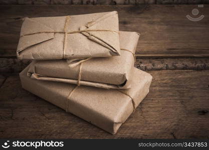 pile parcel wrapped with brown kraft paper and tied with twine