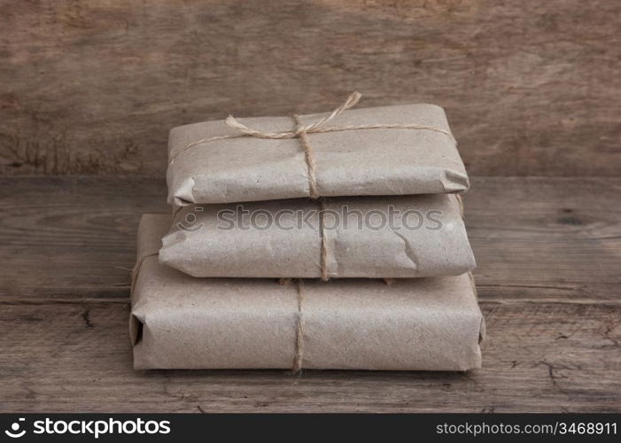 pile parcel wrapped with brown kraft paper and tied with twine