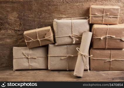 pile parcel wrapped with brown kraft paper and tied with twine