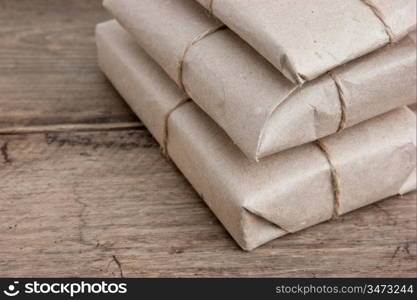 pile parcel wrapped with brown kraft paper and tied with twine