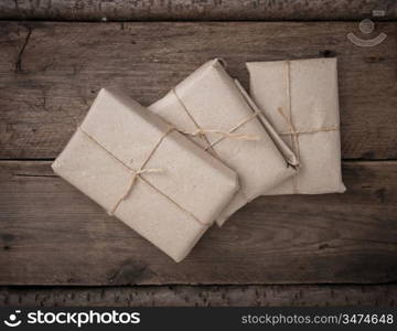 pile parcel wrapped with brown kraft paper and tied with twine