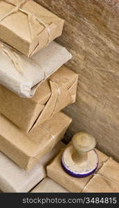 pile parcel wrapped with brown kraft paper and tied with twine