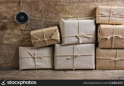 pile parcel wrapped with brown kraft paper and tied with twine