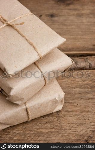pile parcel wrapped with brown kraft paper and tied with twine