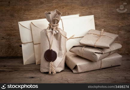 pile parcel wrapped with brown kraft paper and tied with twine