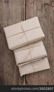 pile parcel wrapped with brown kraft paper and tied with twine