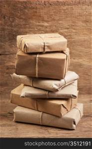 pile parcel wrapped with brown kraft paper and tied with twine
