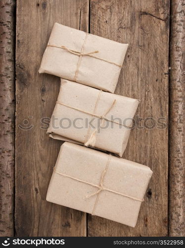 pile parcel wrapped with brown kraft paper and tied with twine