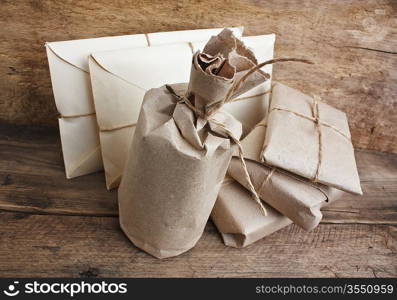 pile parcel wrapped with brown kraft paper and tied with twine