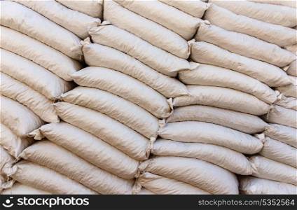 Pile sacks in warehouse