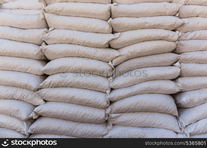 Pile sacks in warehouse