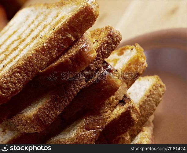 pile toasted bread slices for breakfast.Close up of toasted white bread in slices