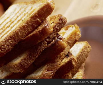 pile toasted bread slices for breakfast.Close up of toasted white bread in slices