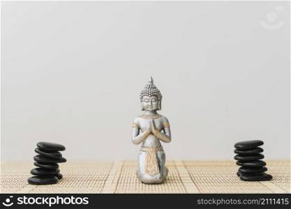 piles black stones buddha