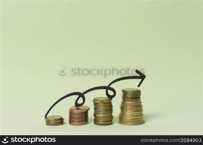 piles coin money with arrow