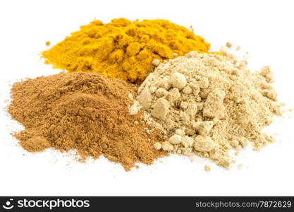 piles of three healthy spices -turmeric, ginger and cinnamon