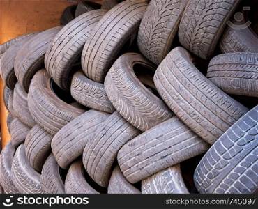 Piles of used and worn car tires
