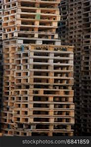 Piles of wooden pallets at a pallet storage