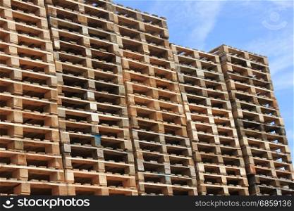 Piles of wooden pallets at a pallet storage