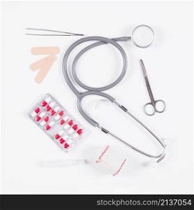 pill blister pack with stethoscope medical equipments white background