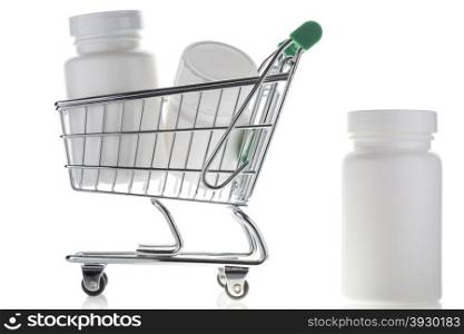 Pill bottle in shopping cart isolated on white. Pill bottle and pills in shopping cart isolated on white. Concept. online store pharmacy