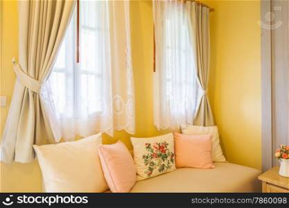 pillow on sofa and curtain in the room