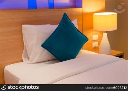Pillows and bedside lamps, modern luxury hotel.