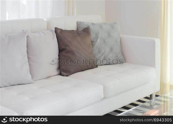 Pillows on white sofa in living room