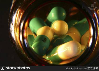 Pills, a selection of pharmaceutical drugs, Legal drugs, packaging, capsules. Bottle of pills Moody Lighting.