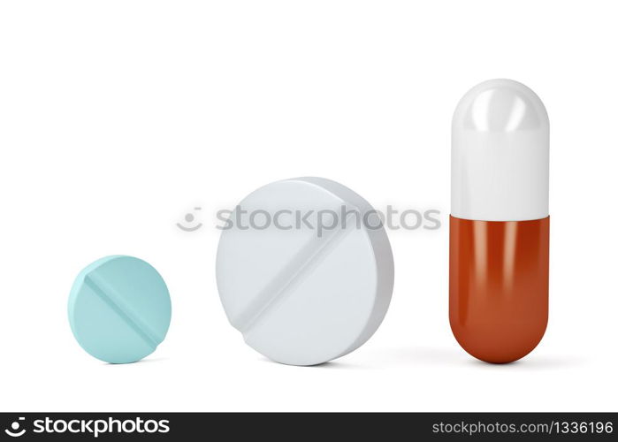 Pills and a capsule on white background