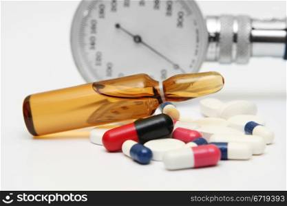 Pills and medicine vial