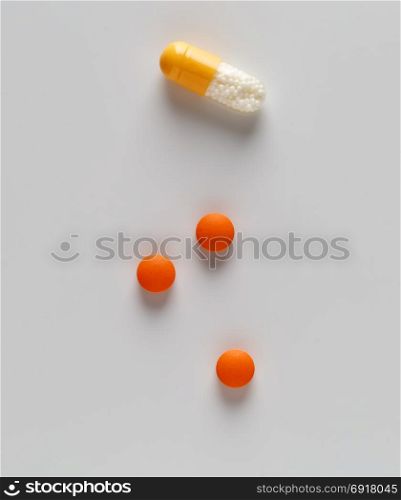 Pills blister packs and white pills bottle. Pills blister packs and white pills bottle on white background
