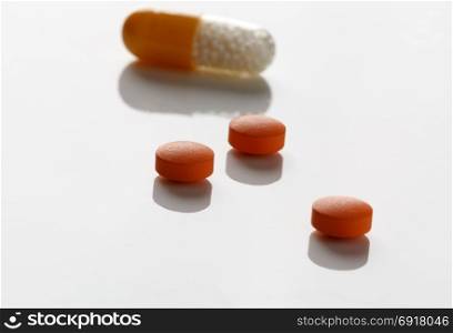 Pills blister packs and white pills bottle. Pills blister packs and white pills bottle on white background