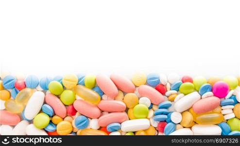 pills border. Multicoloured medical pills