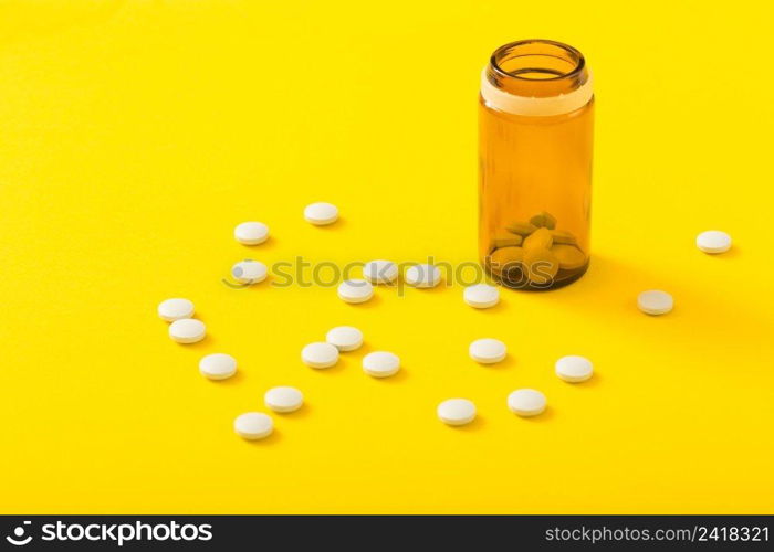 pills bottle circular white medicine yellow background