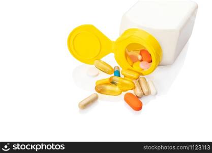 Pills from a drug bottle isolated on white background.