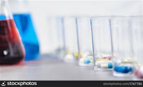 Pills in Disposable Plastic Cup. Medication concept . Pills in a Disposable Plastic Cup