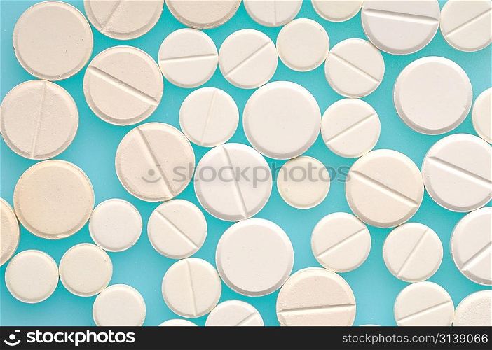 Pills on blue background