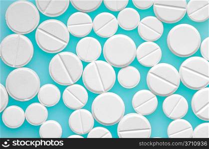 Pills over color background