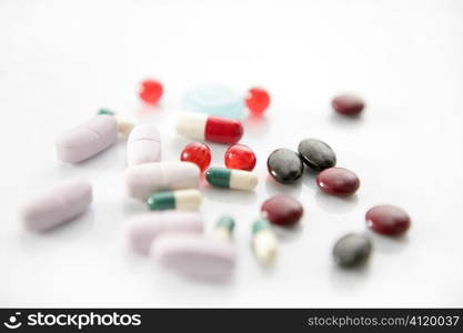 pills over white, health or suicide