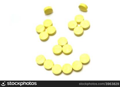Pills smiling face on white background