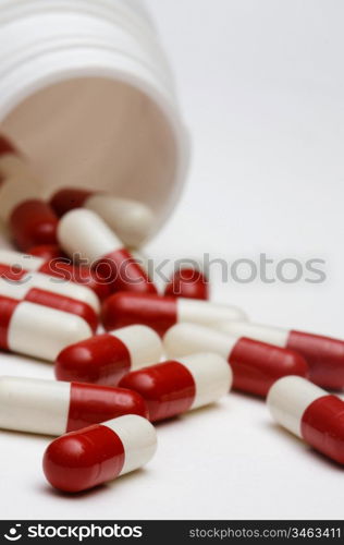 Pills whit shallow DOF a over white background