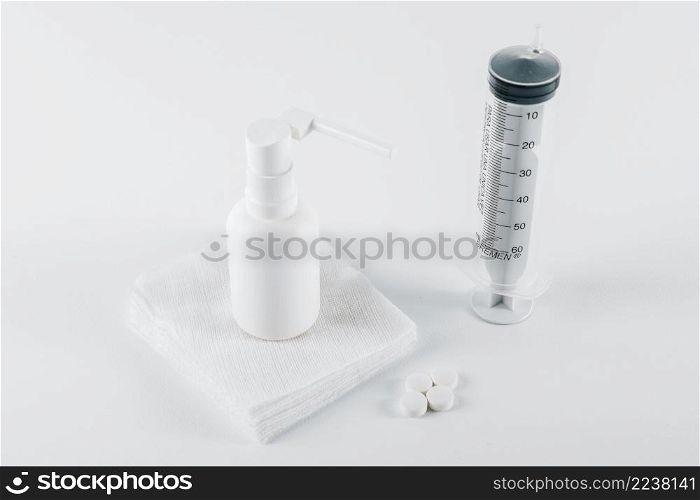 pills white balloon spray medical gauze empty syringe treatment white background