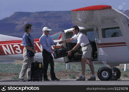 Pilot Loading Passengers Into Cessna, Moab utah