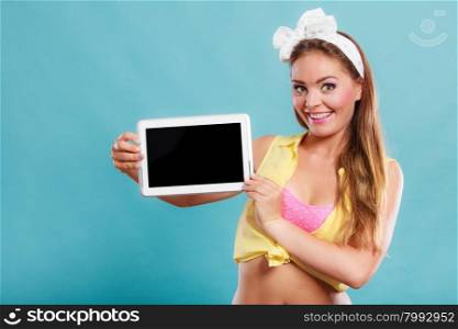 Pin up girl holding tablet computer with blank screen copyspace. Retro woman advertising new modern technology.